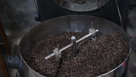 coffee beans being roasted in a roasting machine