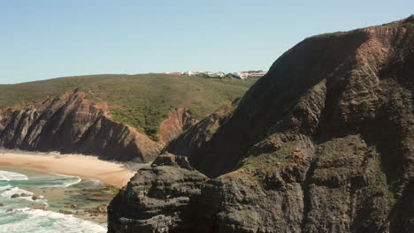 Aerial:-The-cliffs-near-the-town-of-Arrifana-in-Portugal