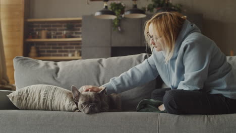 red haired woman watch her dog bulldog 1