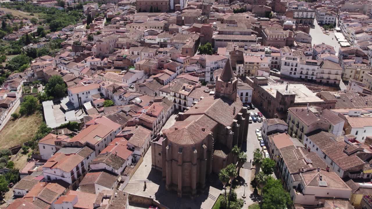 Iglesia de Santiago el Mayor aerial view descending towards old city catholic church in C&aacute;ceres, Spain