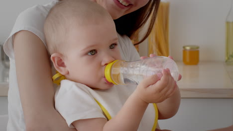 baby drinking from bottle