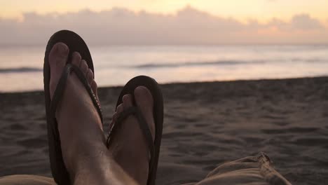 pov shot of feet on a beach