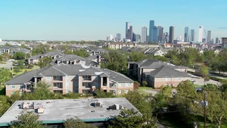 a pan across a suburban area of houston with the downtown distant