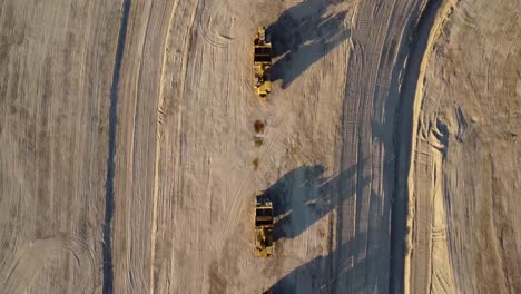 veridical drone video of excavation scraper machines in the desert