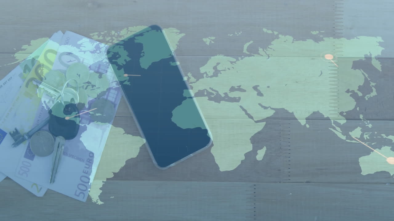 Smartphone, euro bills, and keys over world map animation on wooden surface