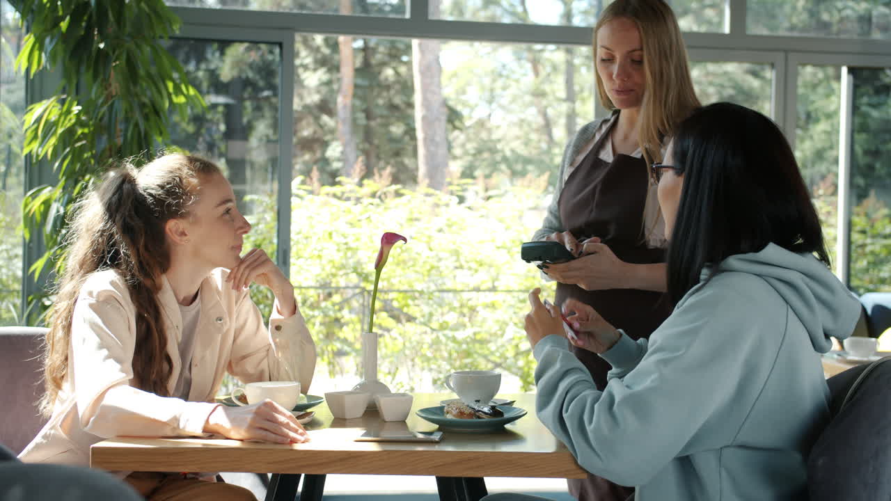 Friends enjoying coffee at a cafe