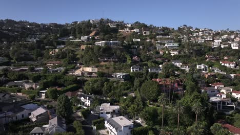 Aerial-cutting-across-Hollywood-Hills-West-multi-million-luxury-homes,-high-end-real-estate