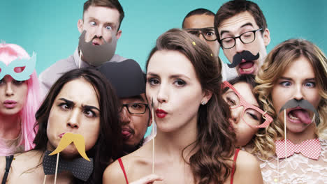 Multi-racial-group-of-funny-people-celebrating-slow-motion-party-photo-booth