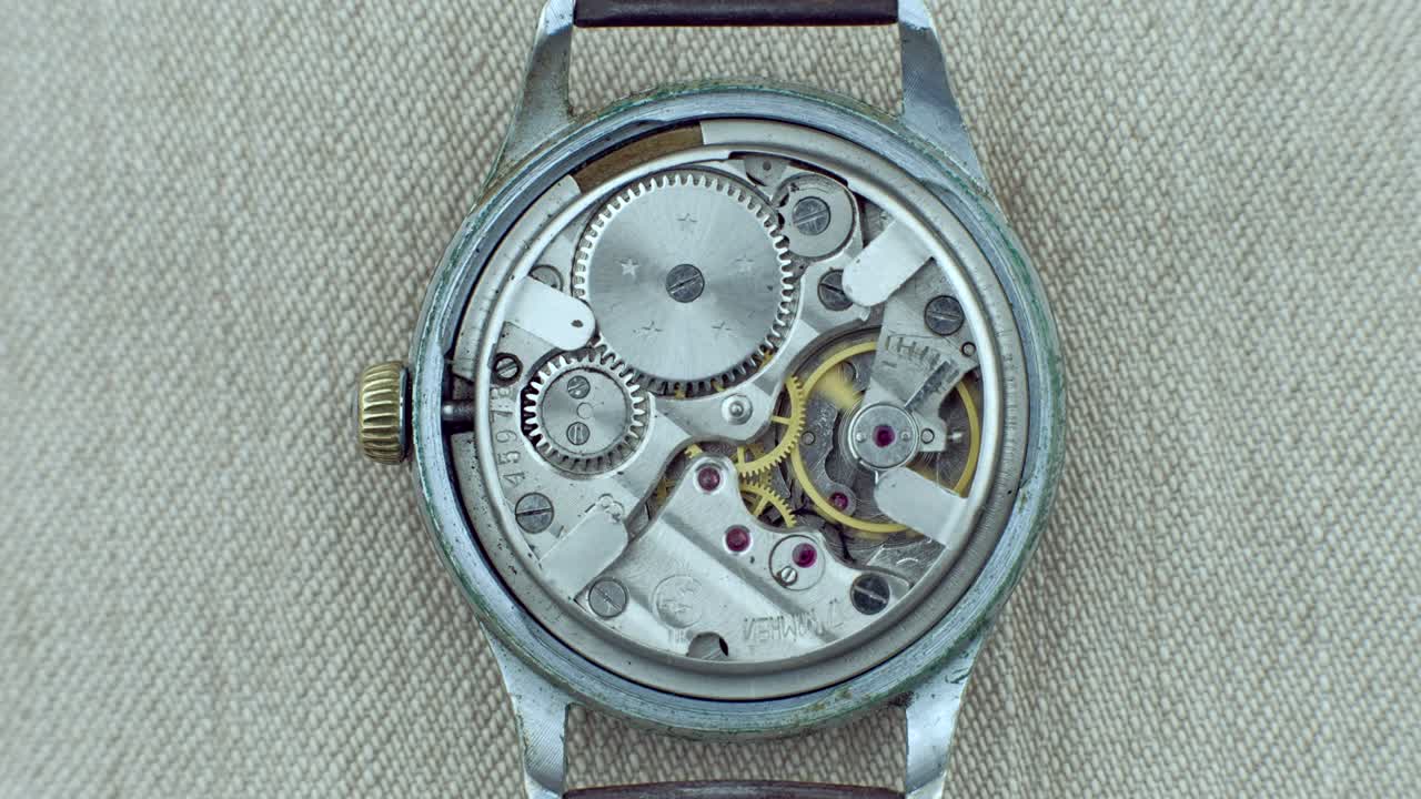 Old vintage clock mechanism working, closeup shot with soft focus