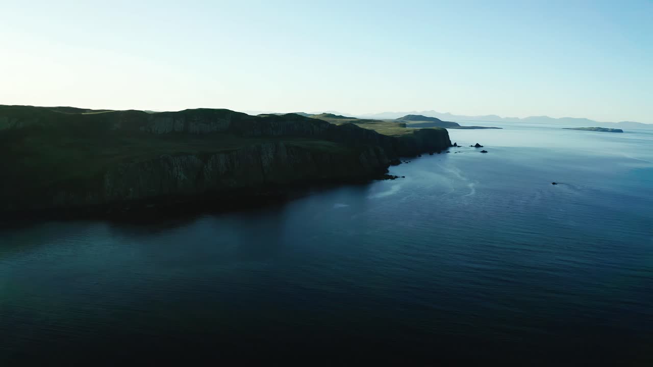 Aerial Over Deep Blue Waters Off Cliffs Off Isle Of Skye In Scotland. Parallax View