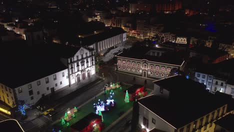 christmas time in funchal at praca do município square with famous church of saint john the evangelist, night, aerial