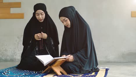 asian muslim woman praying and prostrating at home