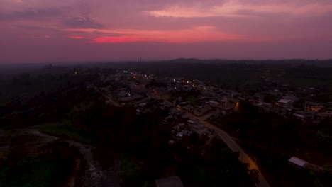 Beautiful-landscape-of-a-Ecuadorian-town-during-a-pink-purple-sunset