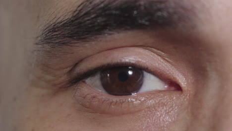 close-up-of-young-man-eye-opening-looking-at-camera-blinking-contemplative-reflection-vision-eyesight