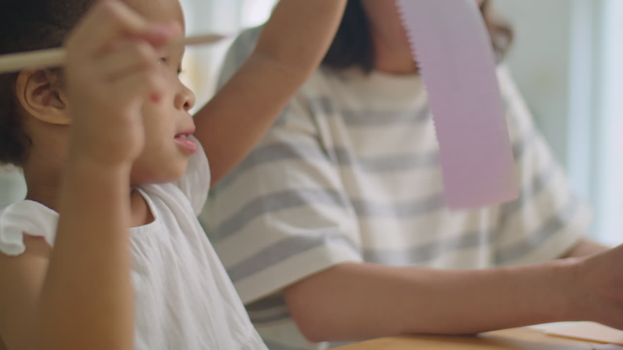 Little Asian Girl Drawing with Mom