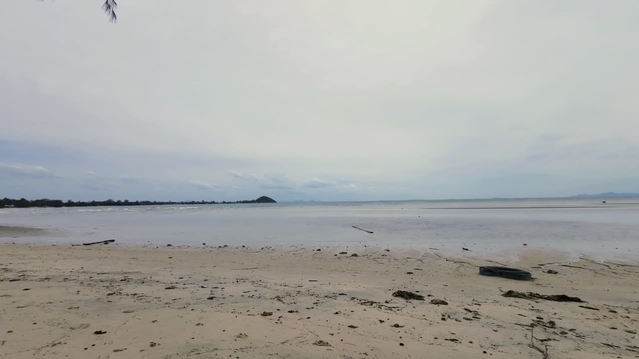 Time-lapse sequence at Lamai Beach, Koh Samui, Thailand, capturing the sandy coastline, turquoise ocean, and fast-moving clouds in a tropical seascape