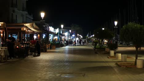 locked shot of bars and restaurants on the marina at night
