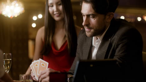 man playing poker at the casino.