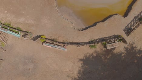 ascending aerial of a cone shaped mud volcano located in bunsee trace penal, trinidad and tobago
