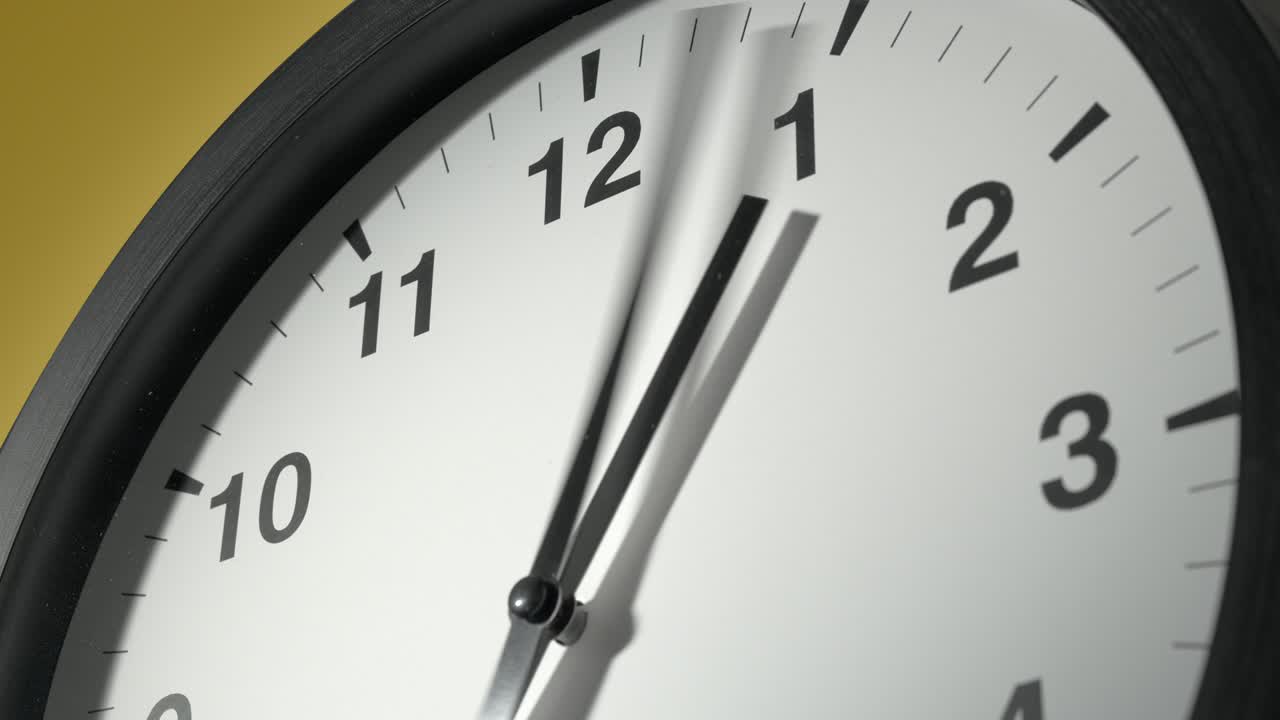 Clock Face on Yellow Wall in Time Lapse