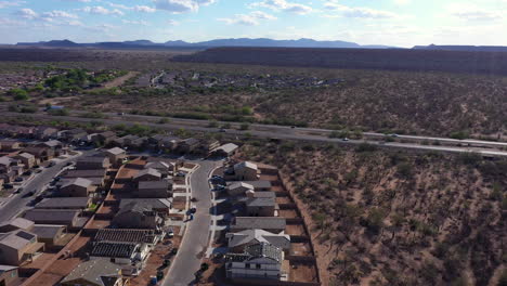 Highway-crossing-Sahuarita-city,-Arizona.-Aerial-forward