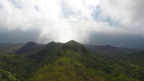 Aerial-drone-shot-over-montagne-pelee,-cliff-and-trees-in-martinique