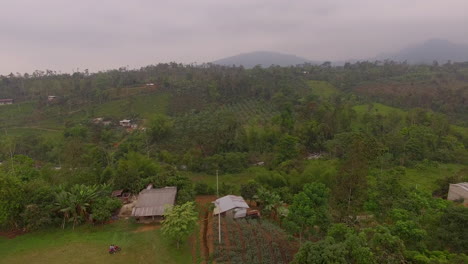 Rural-Ecuadorian-town-with-misty-mountains-and-fields-in-the-distance