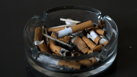 cigarette falling into ashtray