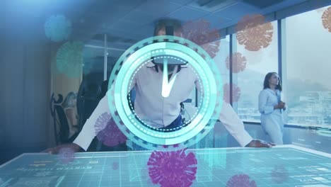 animation of clock and covid virus cells over man in vr headset working in office