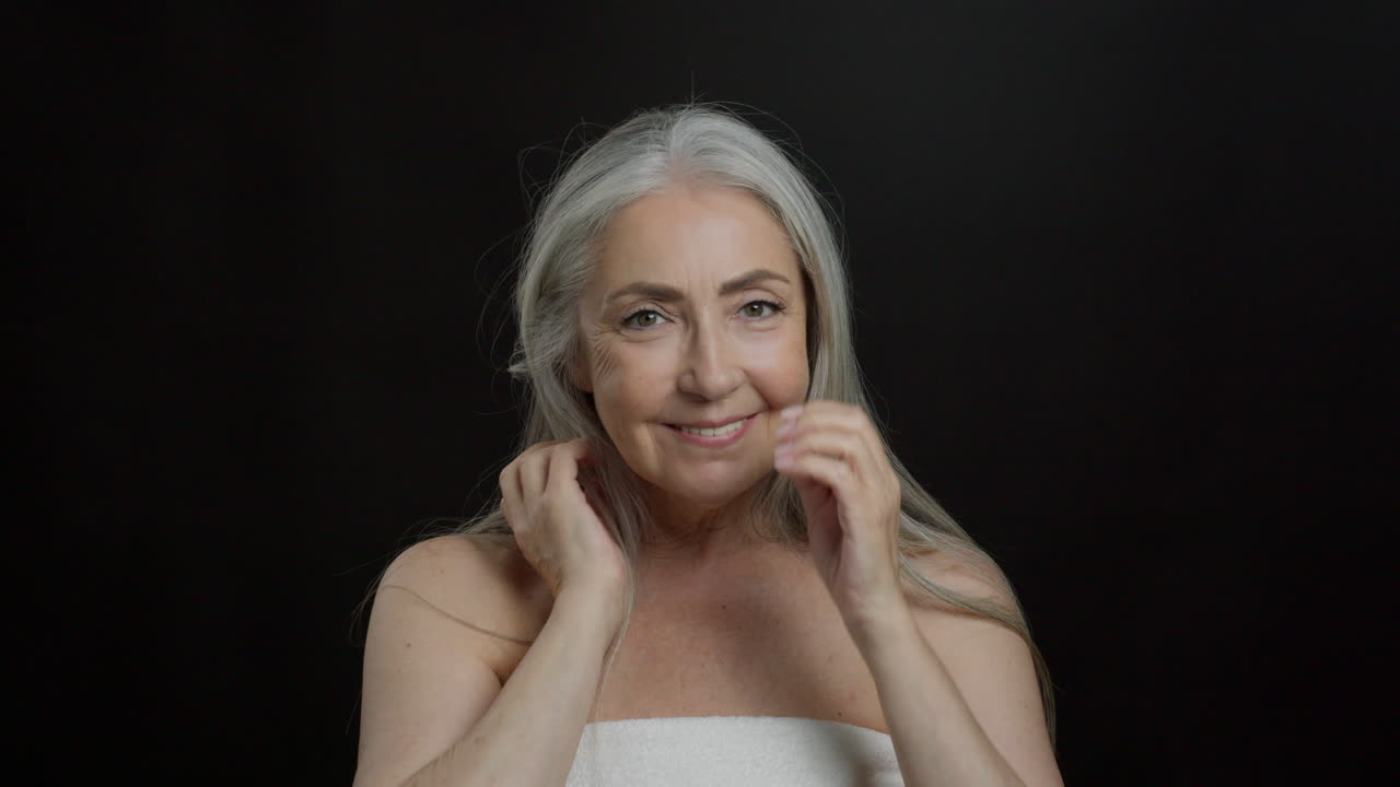 Beauty portrait of a smiling senior woman with gray hair