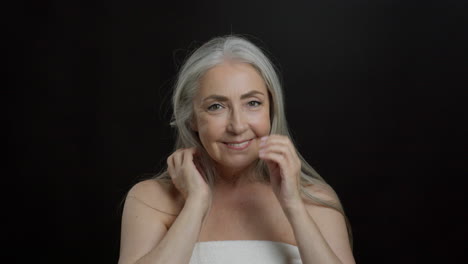 beauty portrait of a smiling senior woman with gray hair