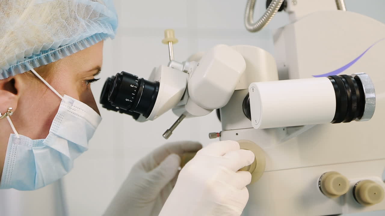 Ophthalmology operation process. Surgeon with operating system of laser vision correction in the operating room