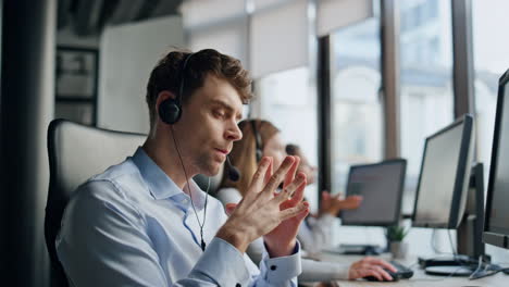 operator listening customer online in office. focused man agent think solution