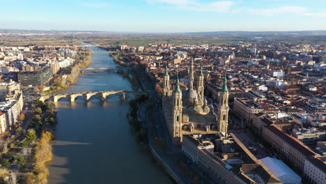 aerial back traveling over the ebro river spain saragossa roman catholic church