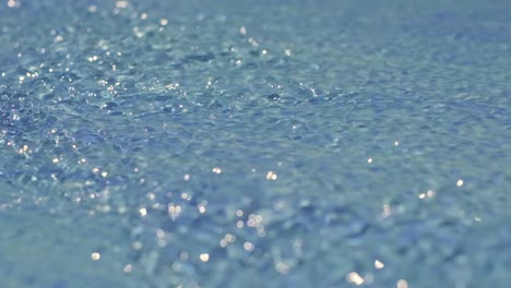 close-up shot of the water flowing from the slide in the aqua park