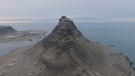 aerial view of volcanic mountain on scenic coastline of iceland, drone shot