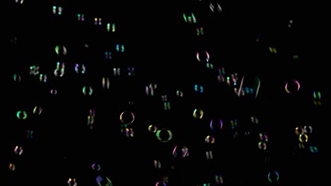 medium soap bubbles spinning slow motion black background medium sized bright soap bubbles spinning slow motion black background
