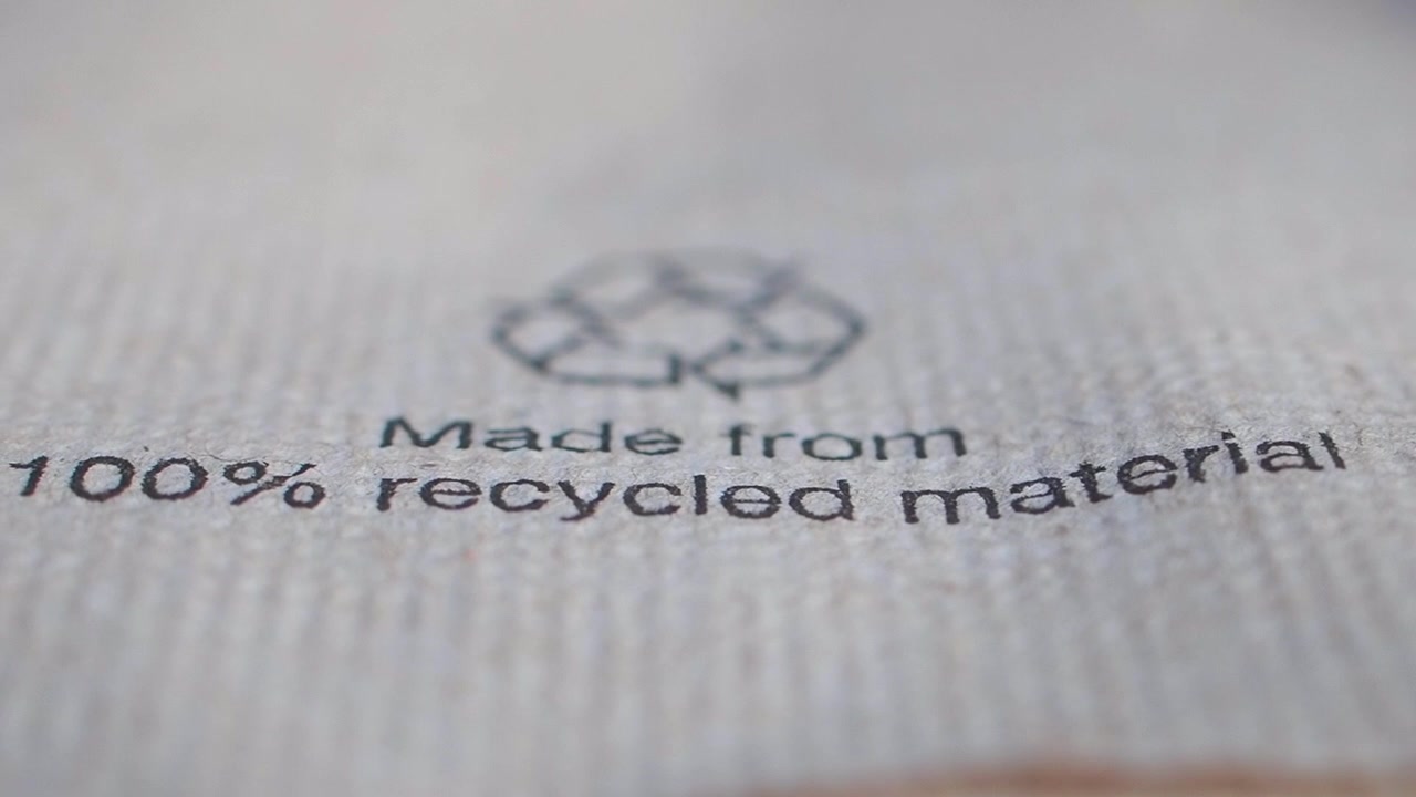Close-up of 100 Percent Recycled Material Label on Paper Packaging