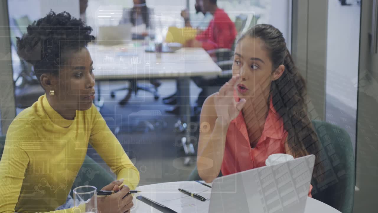 Animation of infographic interface over buildings, diverse coworkers discussing reports on laptop