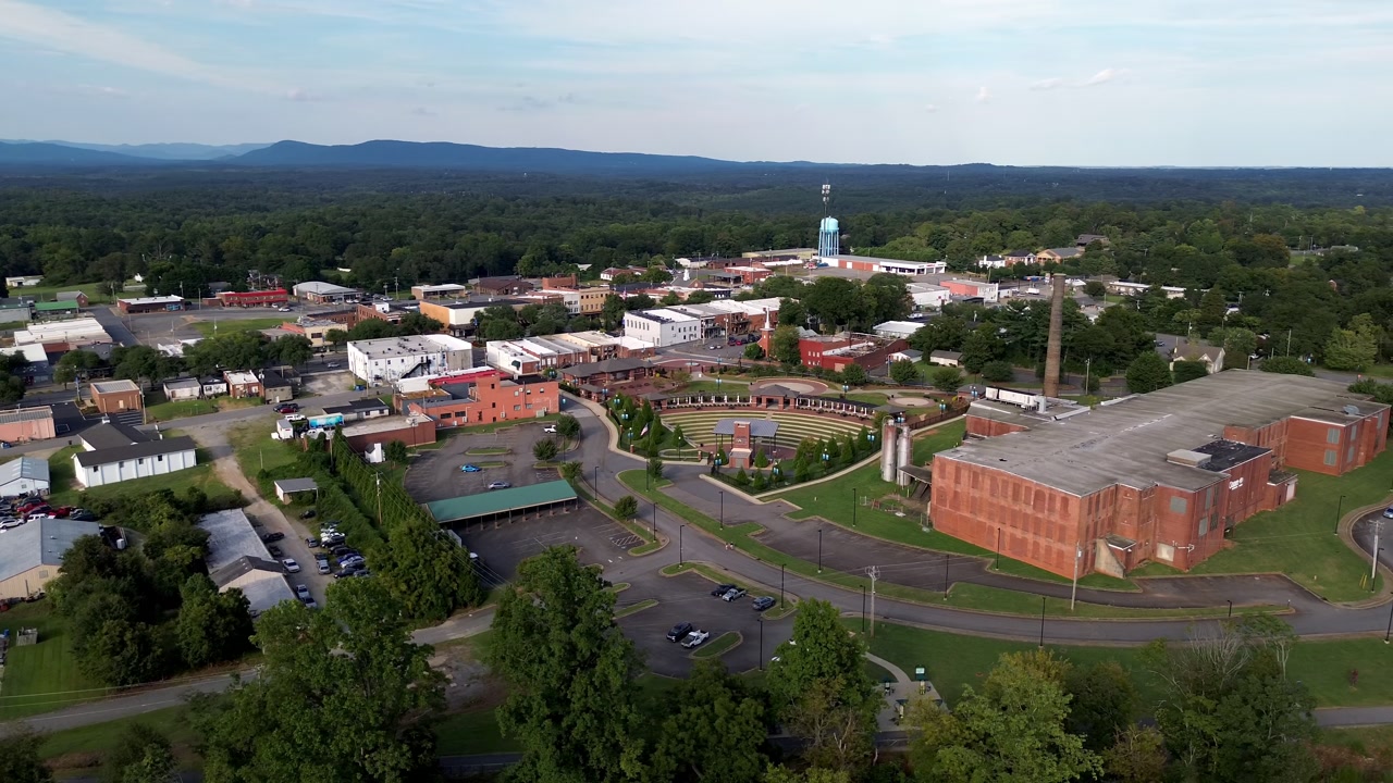 aerial orbit forest city nc with south mountains in the distance