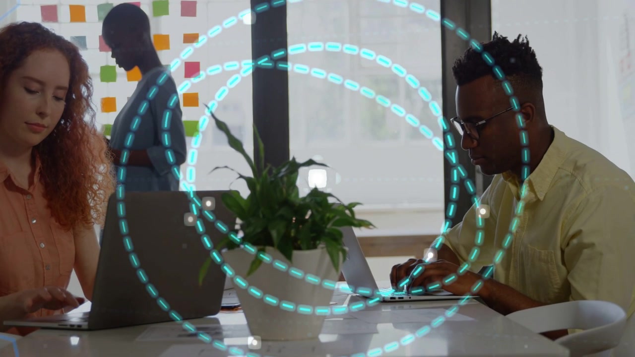 White dot popping at table sparking teal rings expanding while seated team typing showing sync