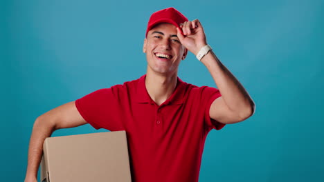 smiling delivery man holding package