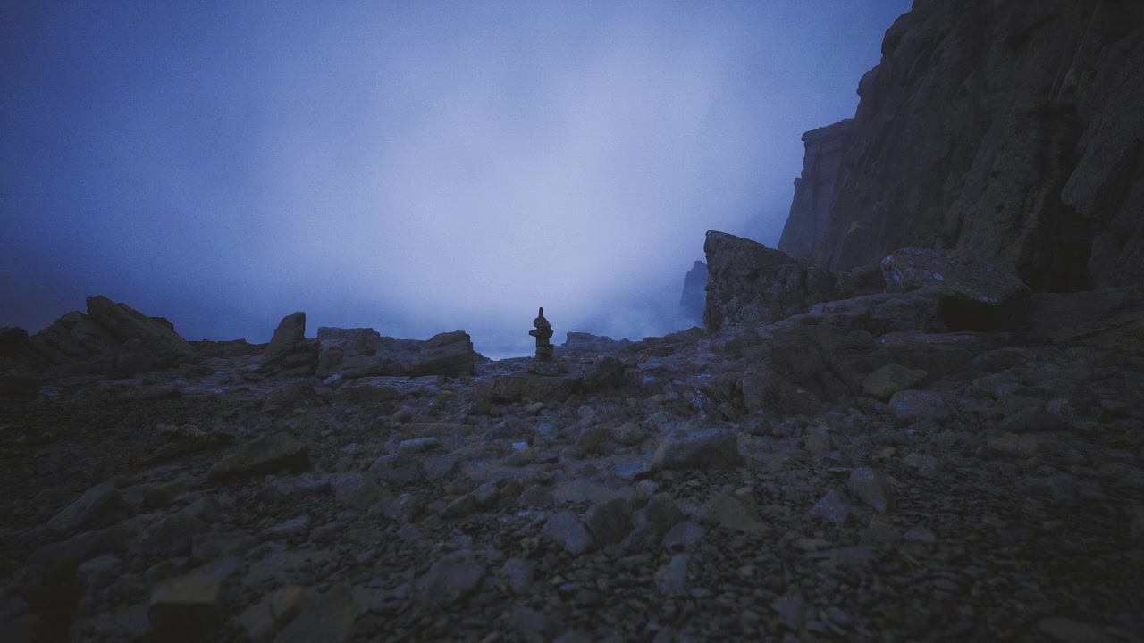 Isolated stone structure amidst rocky terrain under twilight haze