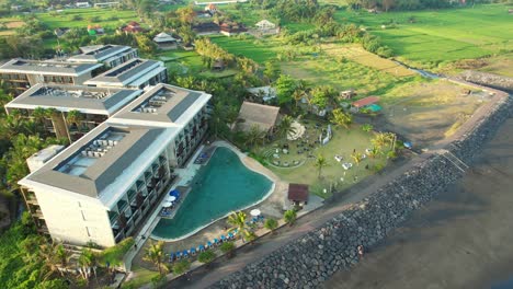 Exterior-of-Wyndham-Tamansari-Jivva-Resort-Bali-Under-Sunset-Sunlight-in-Klungkung-Bali,-Indonesia---Aerial-Parallax
