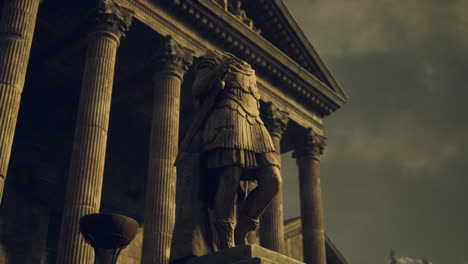 ancient roman statue in front of a historical building