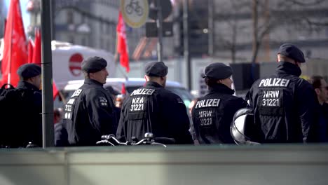 police officer at demonstration in germany. police force keep public demonstration safe. danger of violence