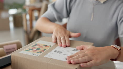 woman packing a box for shipping