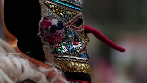 beads mask of bulgarian kuker with elongated red nose