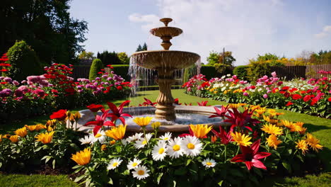 beautiful garden fountain surrounded by colorful flowers