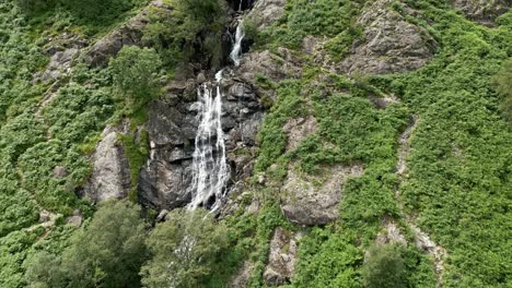 drone aerial footage of the 100ft taylor gill force waterfall at borrowdale, seathwaite and is one of the highest waterfalls, in the lake district national park